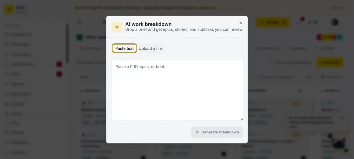 The AI work breakdown dialog with a Paste text tab and an Upload a file tab, a text area reading "Paste a PRD, spec, or brief," and a Generate breakdown button.